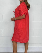 Vestido de lino con mangas largas y elegantes botones