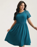 Vestido con bolsillos y mangas cortas con aberturas de encaje®